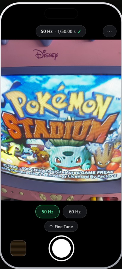 CRT Camera with the 50 Hz preset selected. The status bar reads “50 Hz · 1/50.00 s” with a confirmation tick, and the live preview shows the Pokémon Stadium title screen on a CRT television.